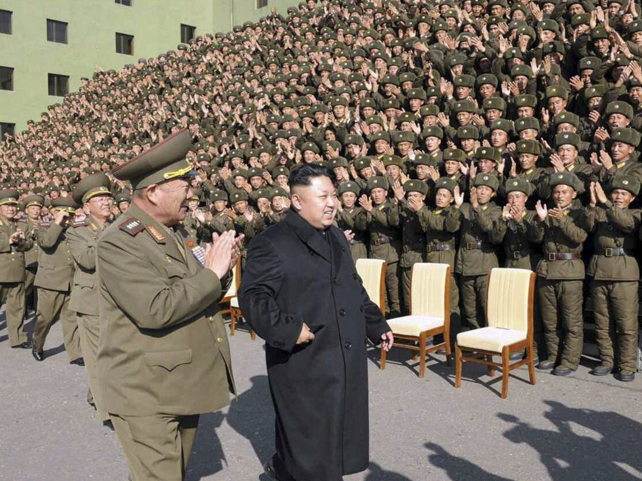 North Korean Central News Agency (KCNA) on 05 November 2014 shows North Korean leader Kim Jong-un attending an event with military commanders