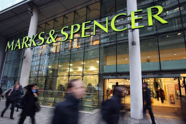 Members of the public walk past a branch of Marks & Spencer on January 7, 2014 in London, England.