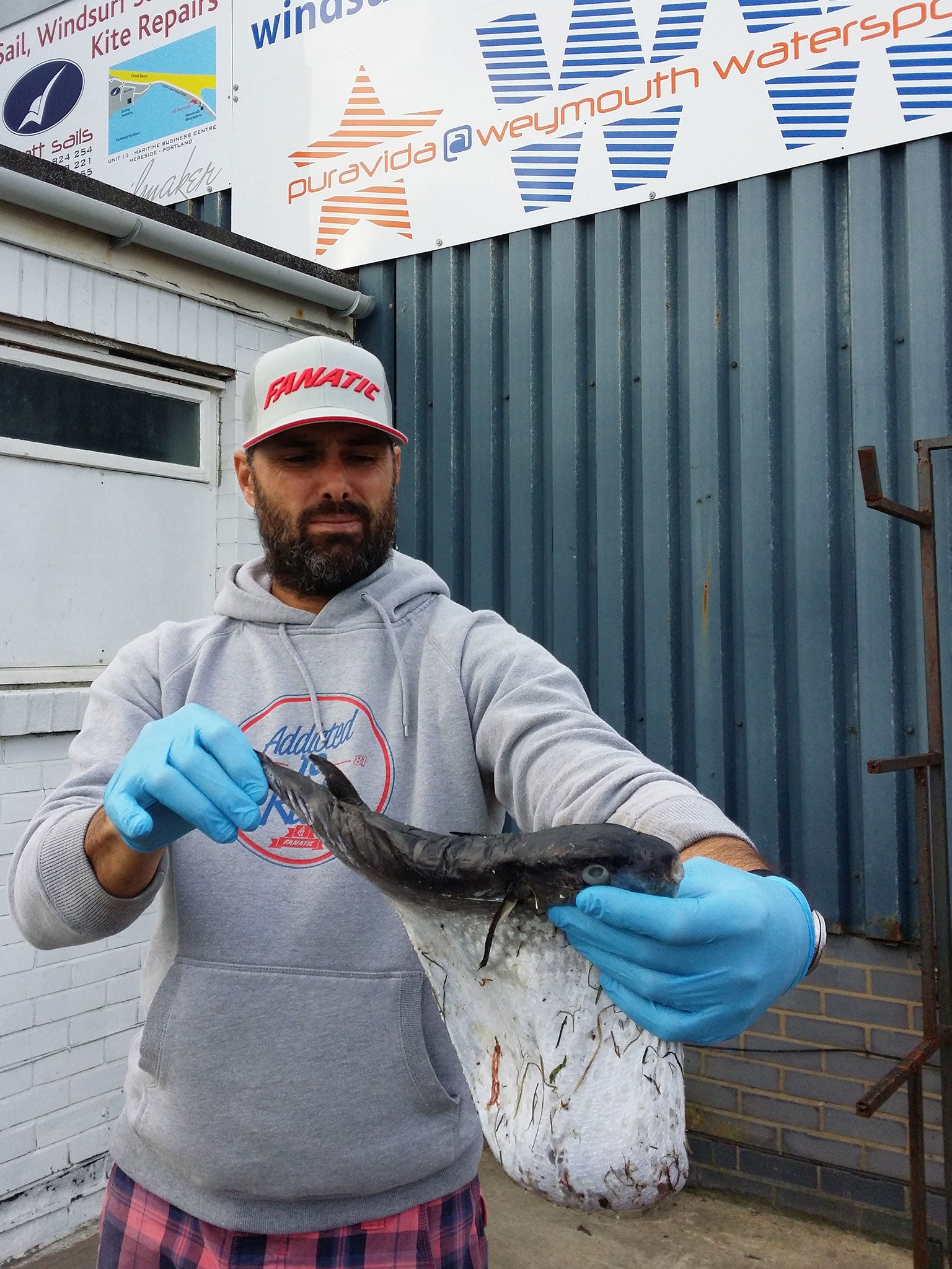 Richard Fabbri holds up the pufferfish (Pic: Marc Smith, Dorset Wildlife Trust)