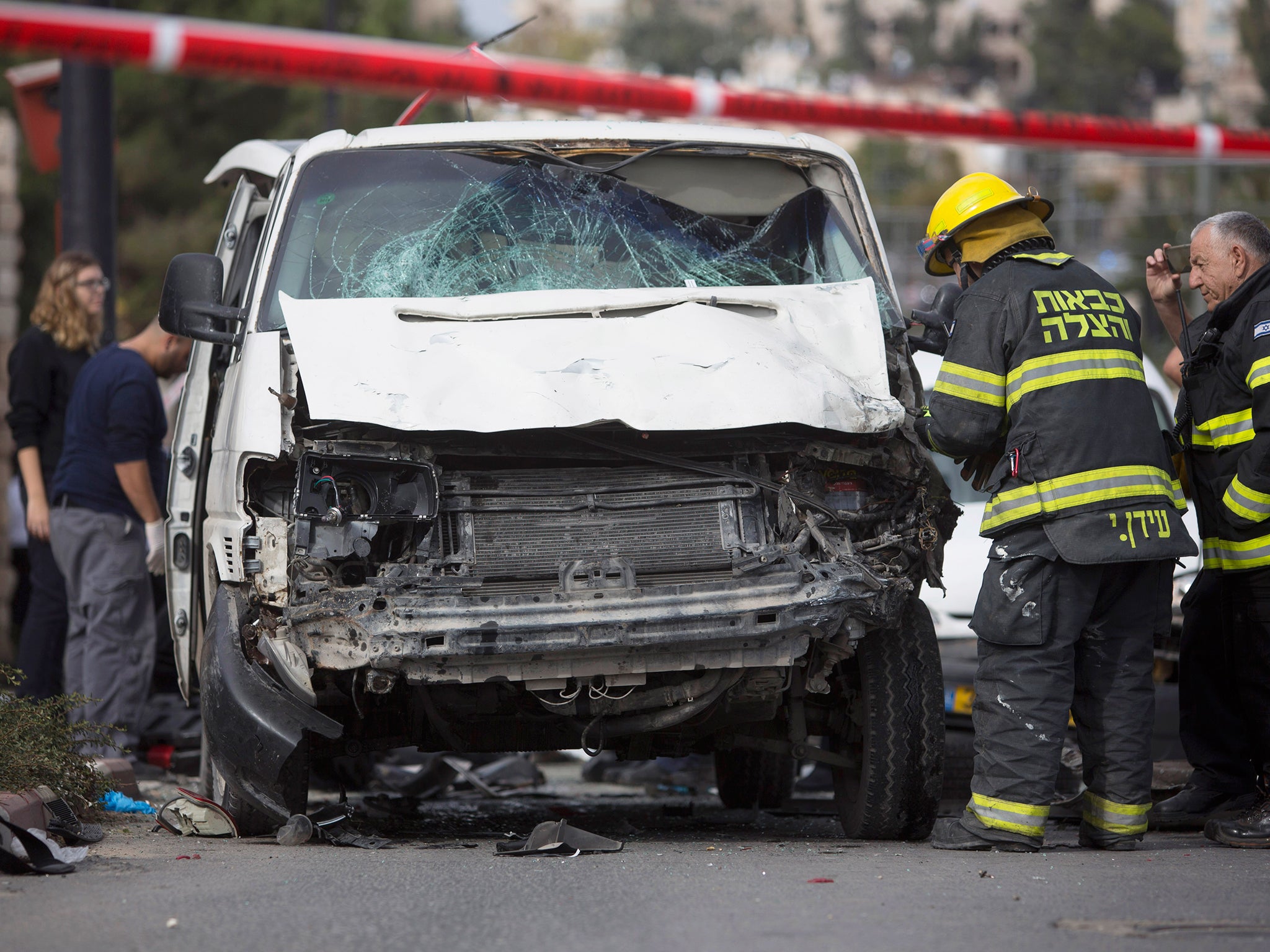 Israeli police say one dead and 13 hurt as car rams crowd in East ...