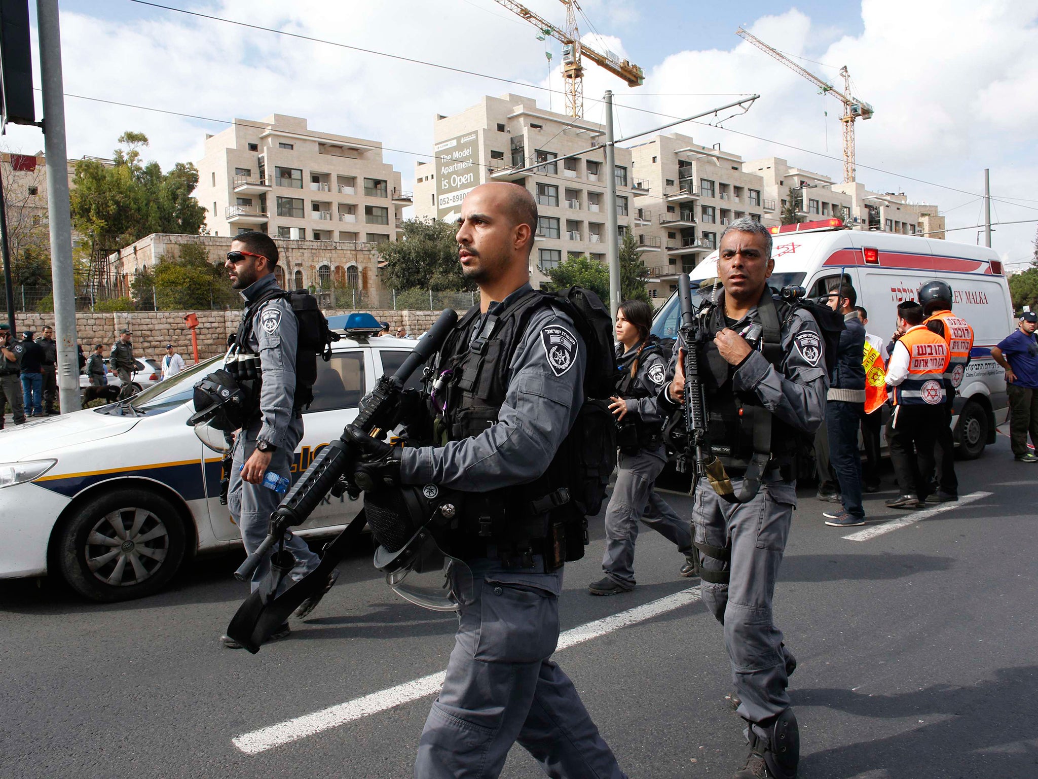 Israeli police say one dead and 13 hurt as car rams crowd in East ...