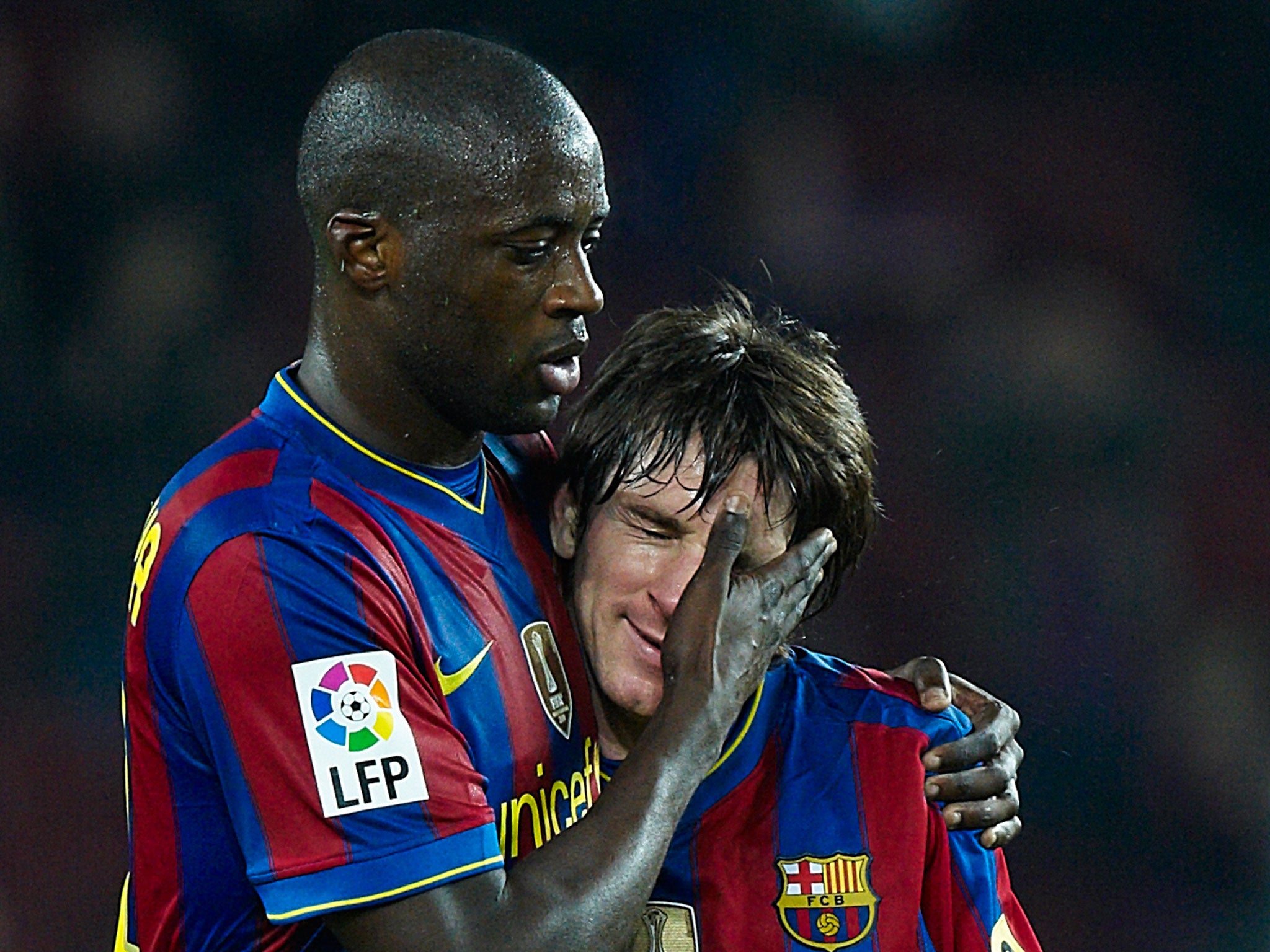 Toure and Lionel Messi at Barcelona