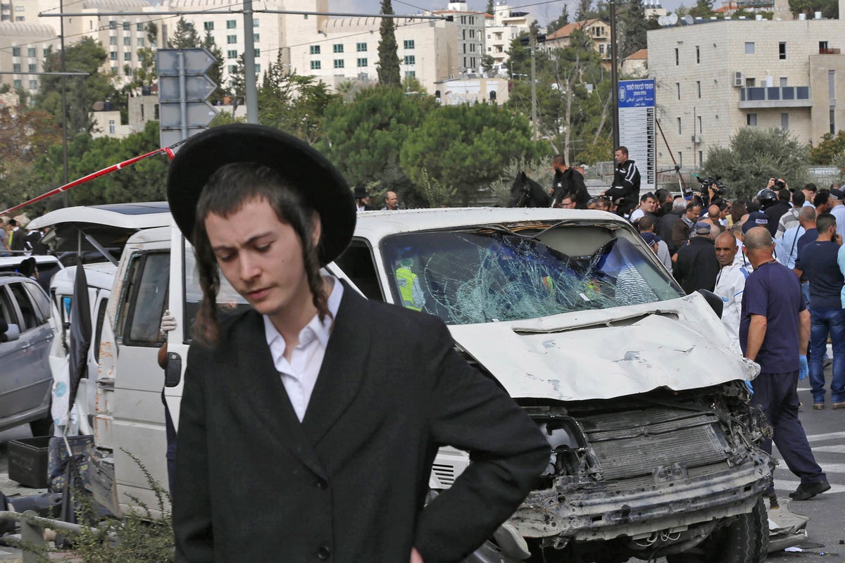 Israeli police say one dead and 13 hurt as car rams crowd in East ...
