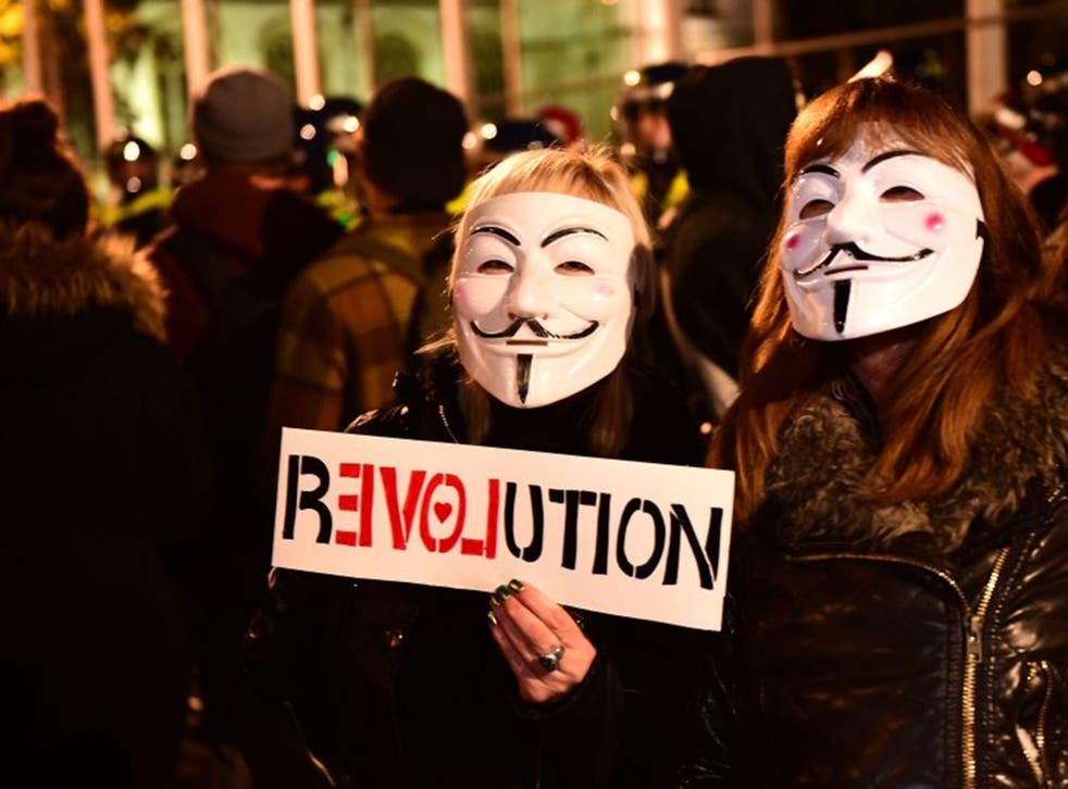 Members of activist group Anonymous during a protest in Parliament Square, central London.
