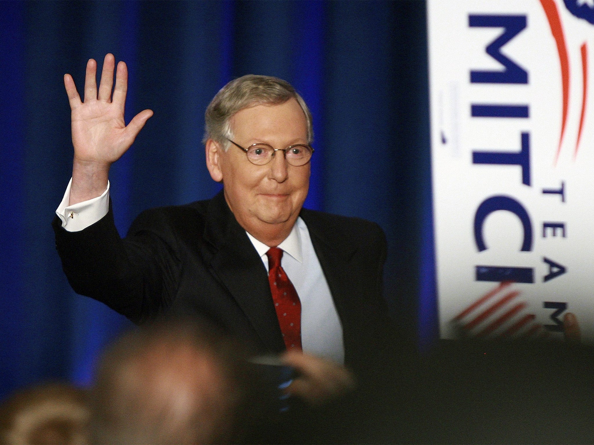 US Senator Mitch McConnell waves to supporters during his victory celebration in Louisville, Kentucky