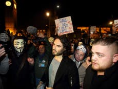 Russell Brand joins Million Mask March in London as violence breaks