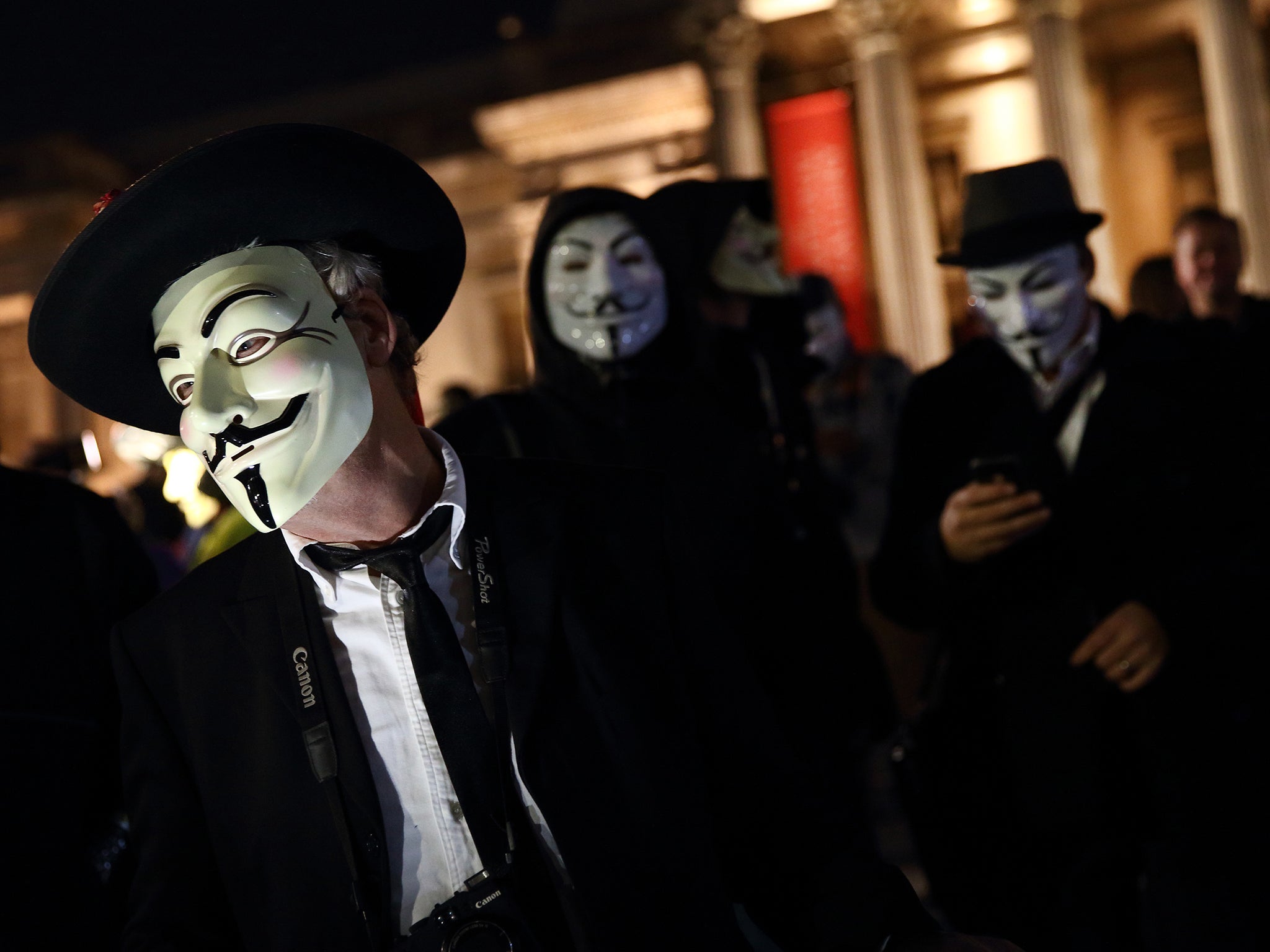 Protestors with covered faces marched from Trafalgar Square to Parliament Square and then around the streets of London in protest against austerity, mass surveillance and attacks on human rights  