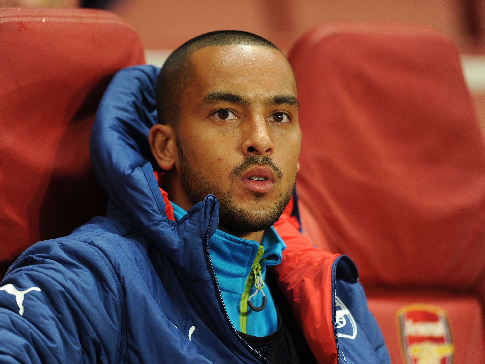 Theo Walcott looks on from the Arsenal bench on Tuesday night