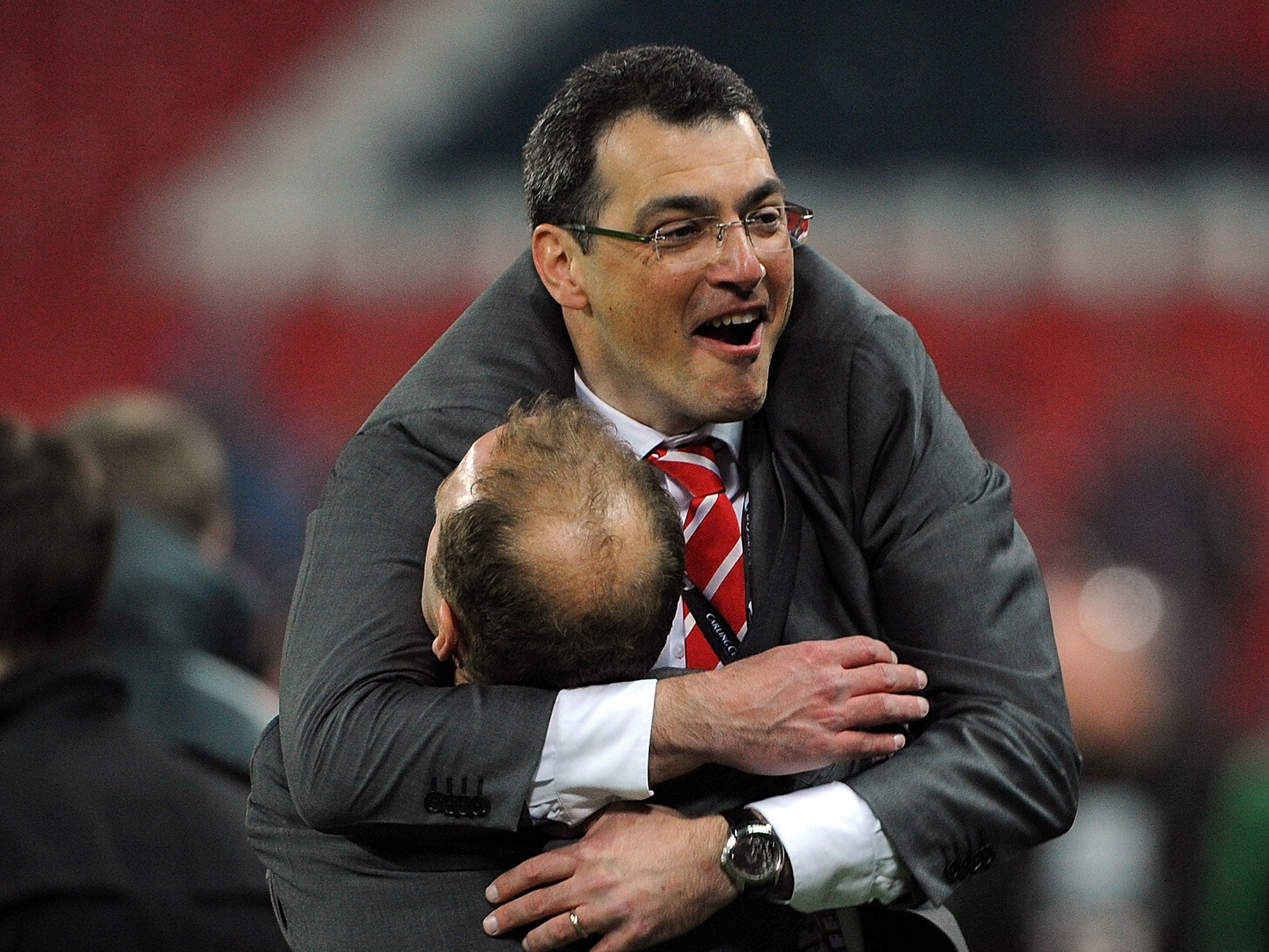 Comolli celebrating the League Cup sucess in 2012