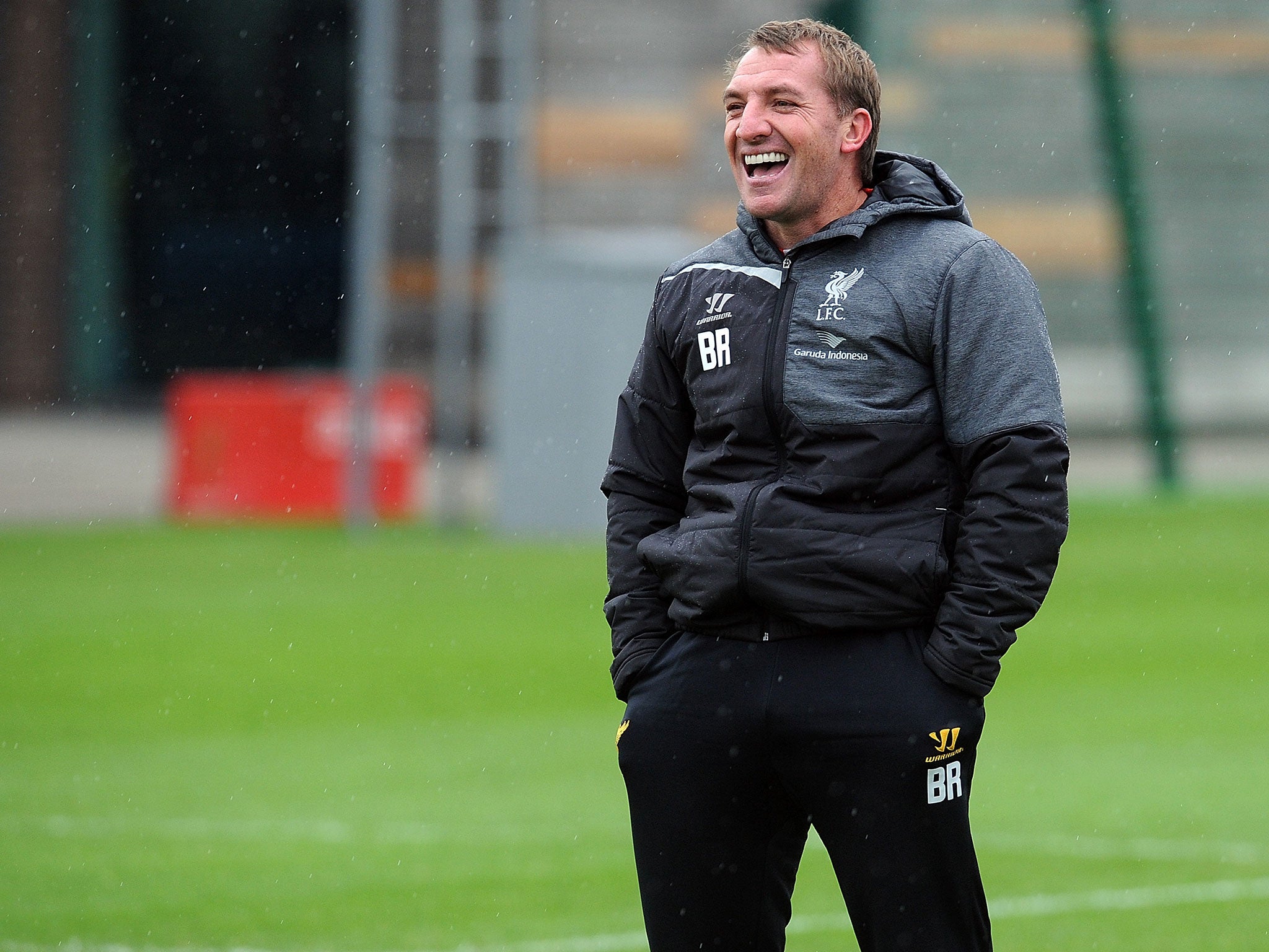Brendan Rodgers laughs during Liverpool training