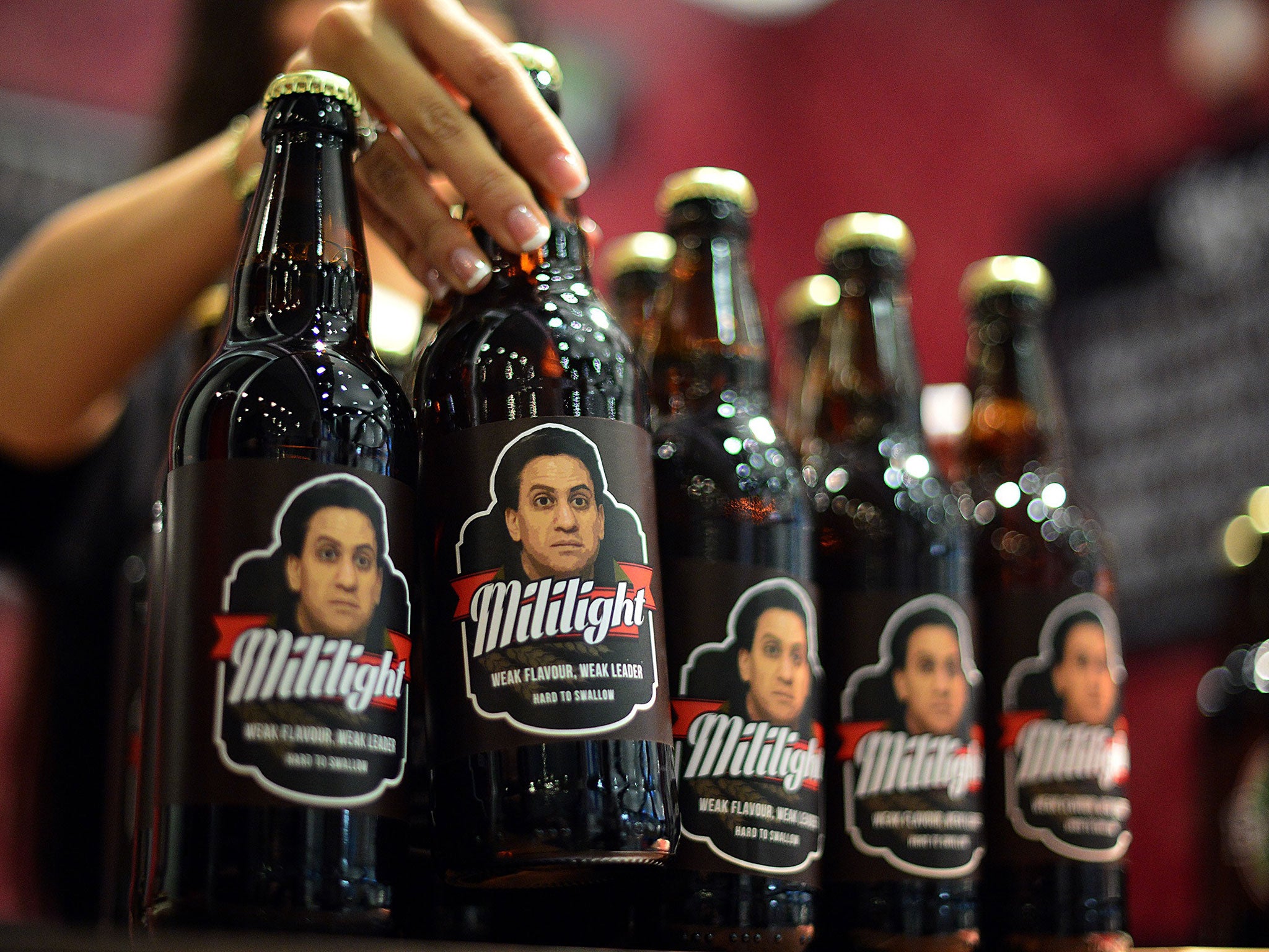 Beer bottles bearing the picture of leader of Britain's main opposition Labour Party Ed Miliband.