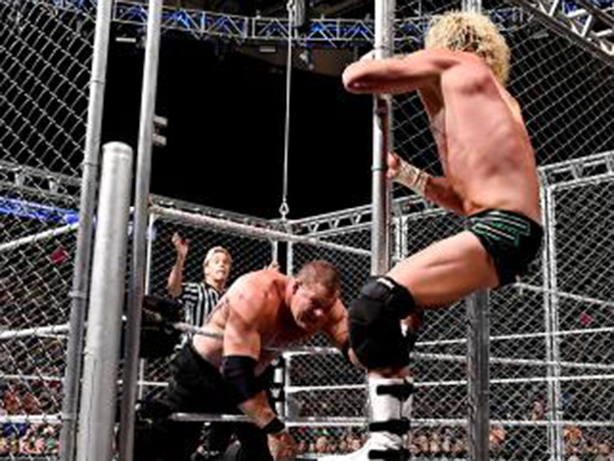 Dolph Ziggler climbs out of the steel cage to beat Kane