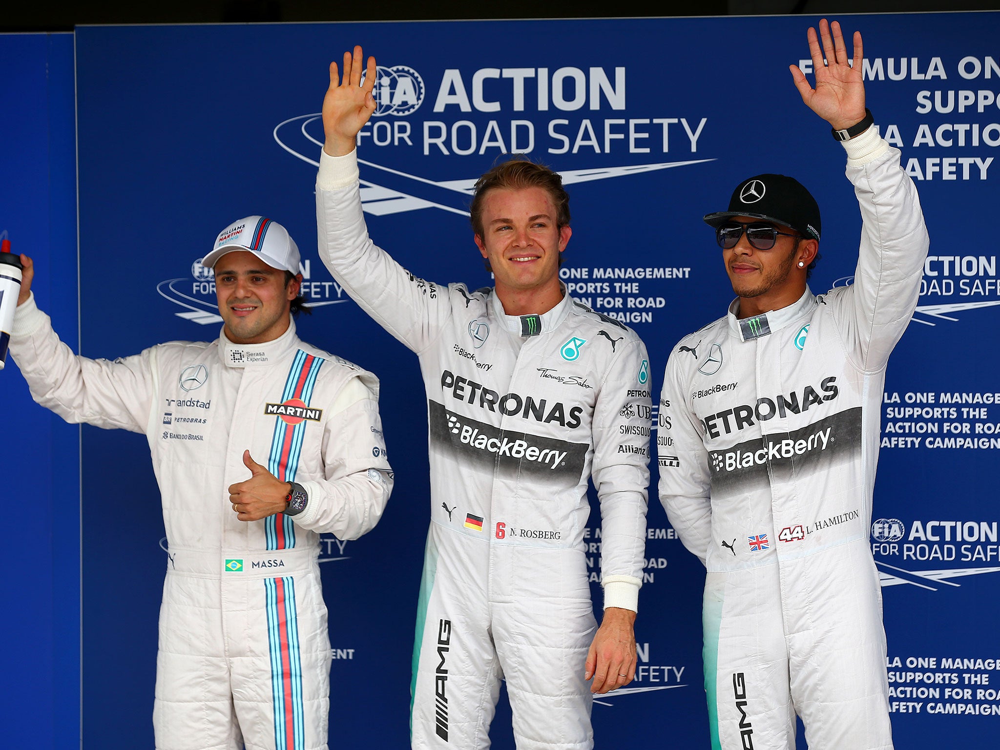 Felipe Massa, Nico Rosberg and Lewis Hamilton wave to the crowd after qualifying