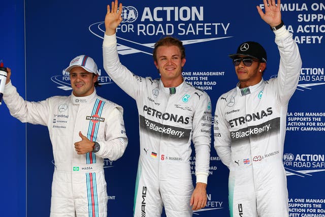Felipe Massa, Nico Rosberg and Lewis Hamilton wave to the crowd after qualifying
