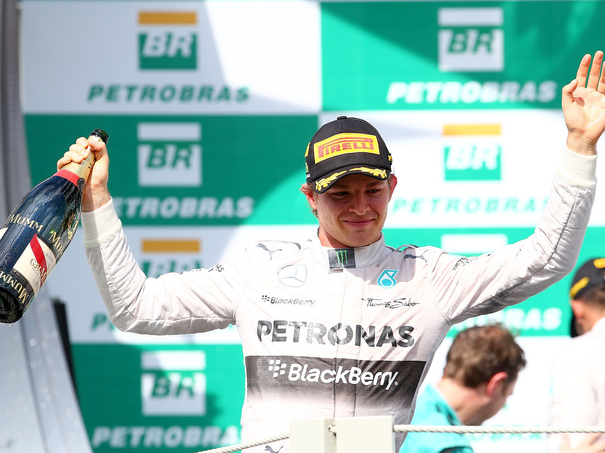 Nico Rosberg celebrates his victory on the podium in Interlagos