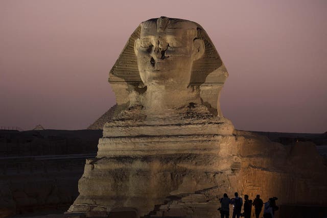 Journalists visit the Sphinx on a media tour following the completion of restoration work in preparation for the reopening of the courtyard around its base, in Giza, near Cairo, Egypt