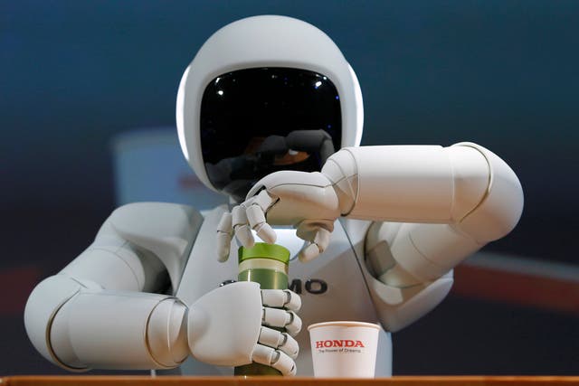 Honda's Asimo robot could one day help care for an aging population - but tablets and spreadsheets are more of a danger to UK workers in the next couple of decades.