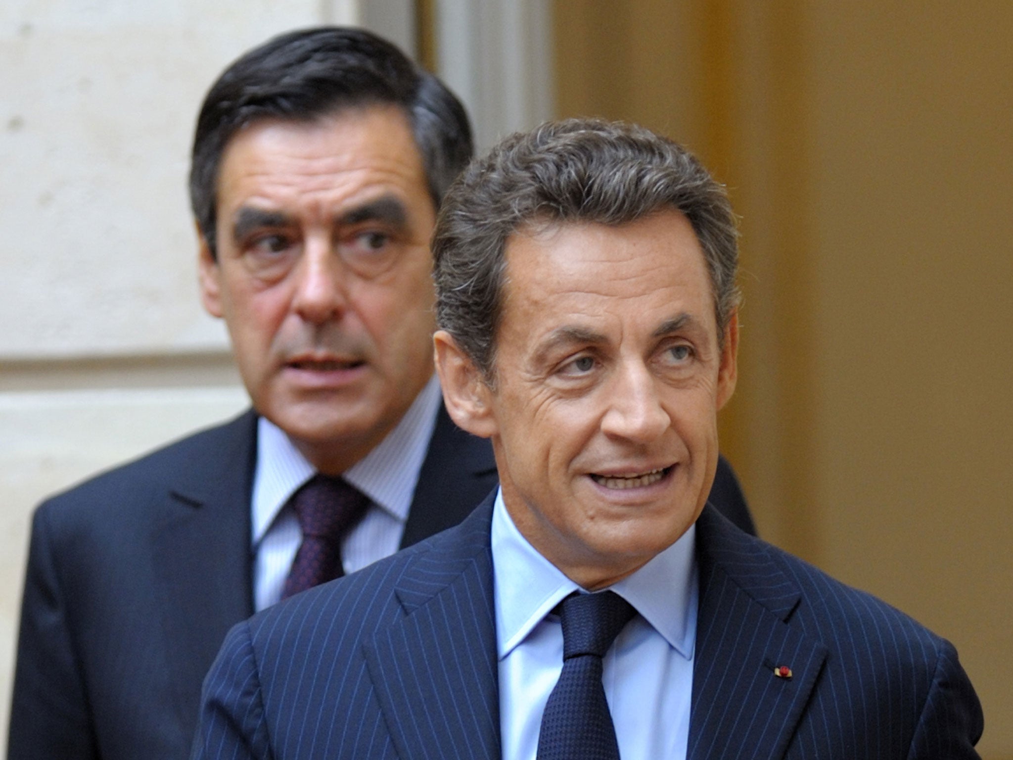 Former Prime Minister François Fillon, left, with Nicolas Sarkozy, accused the aide of lying