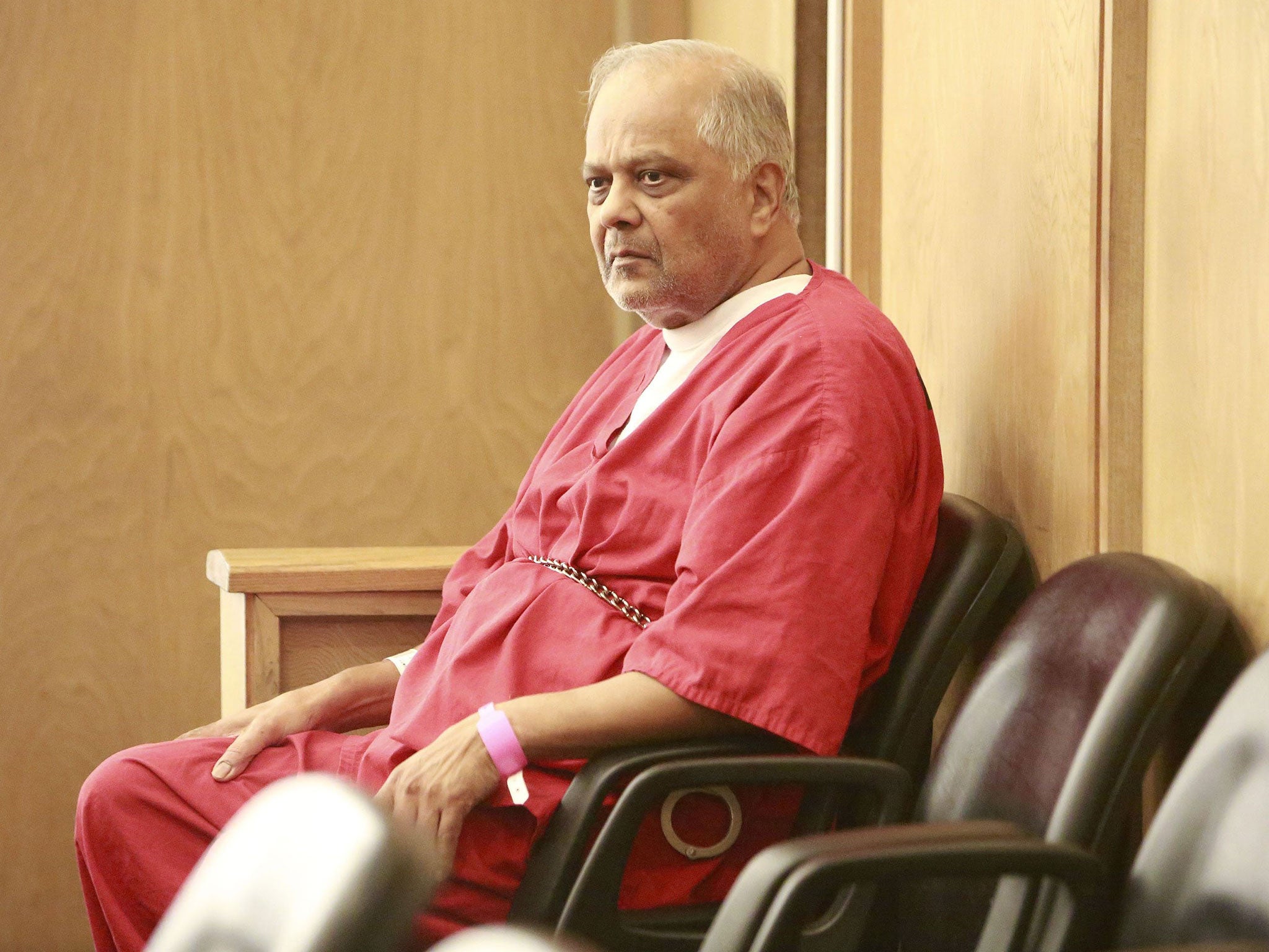 Krishna Maharaj sits in Circuit Court during a legal hearing in Miami, Florida, November 10, 2014