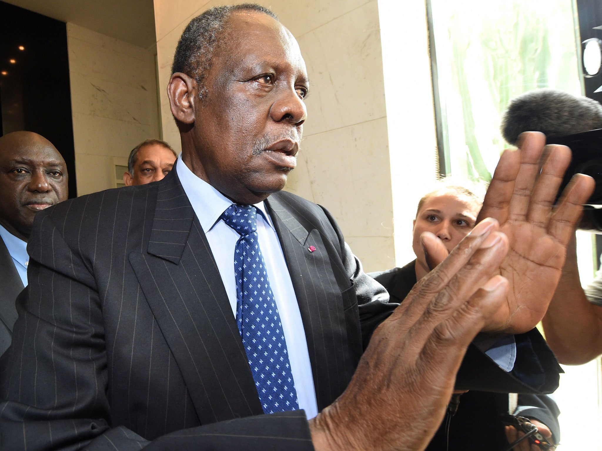 Issa Hayatou, president of the Confederation of African Football (CAF) leaves his hotel in Rabat