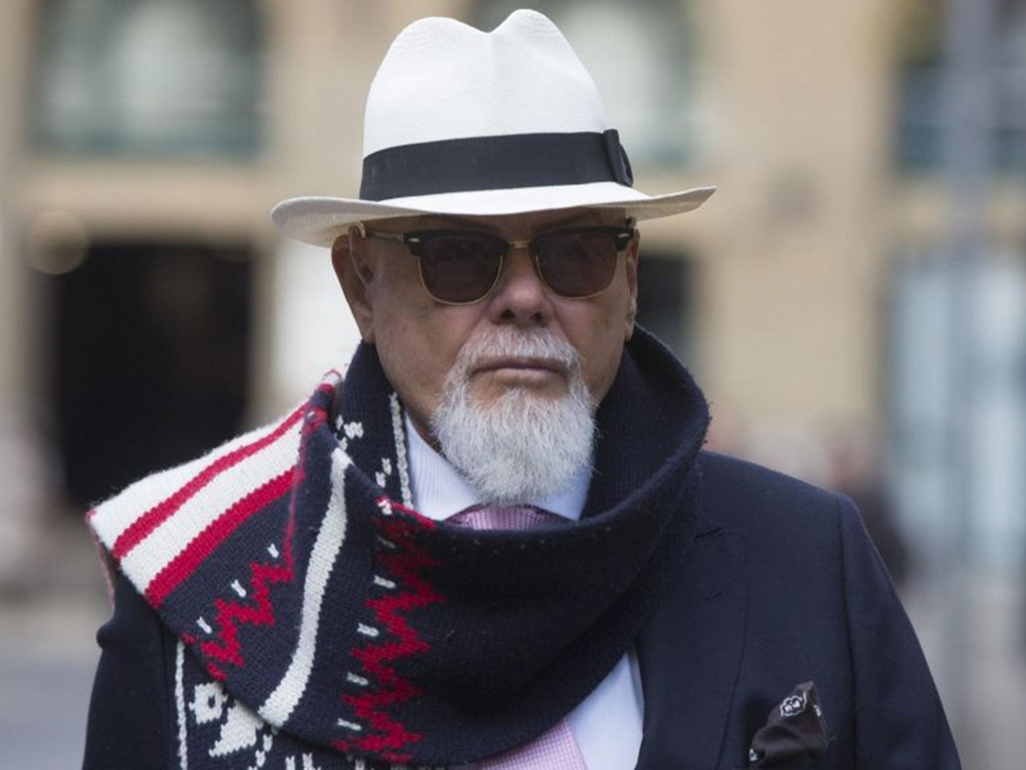 Former British pop star Gary Glitter, whose real name is Paul Gadd, arrives at Southwark Crown Court in London November 1