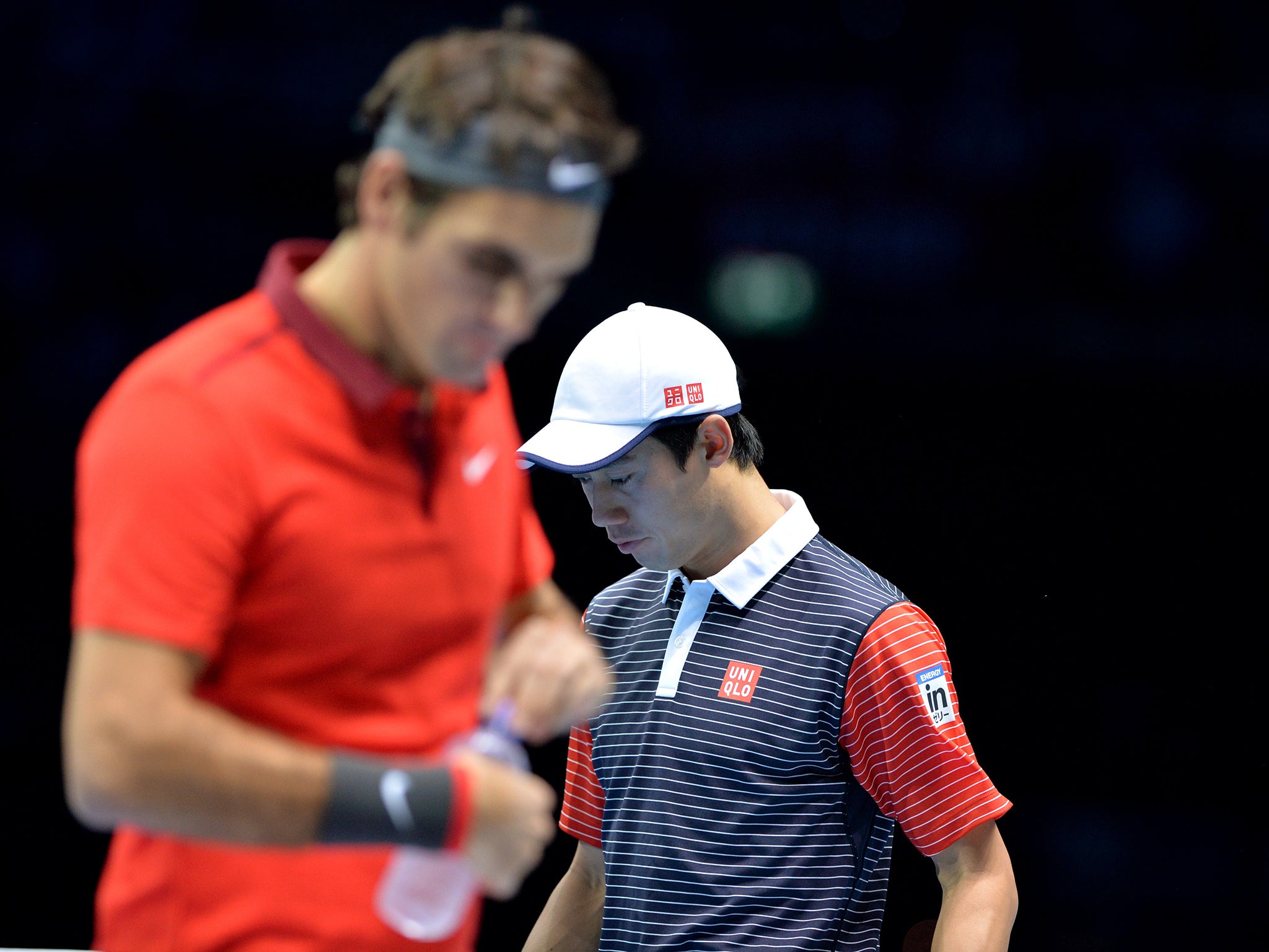 Switzerland's Rodger Federer and Japan's Kei Nishikori during their match at the O2