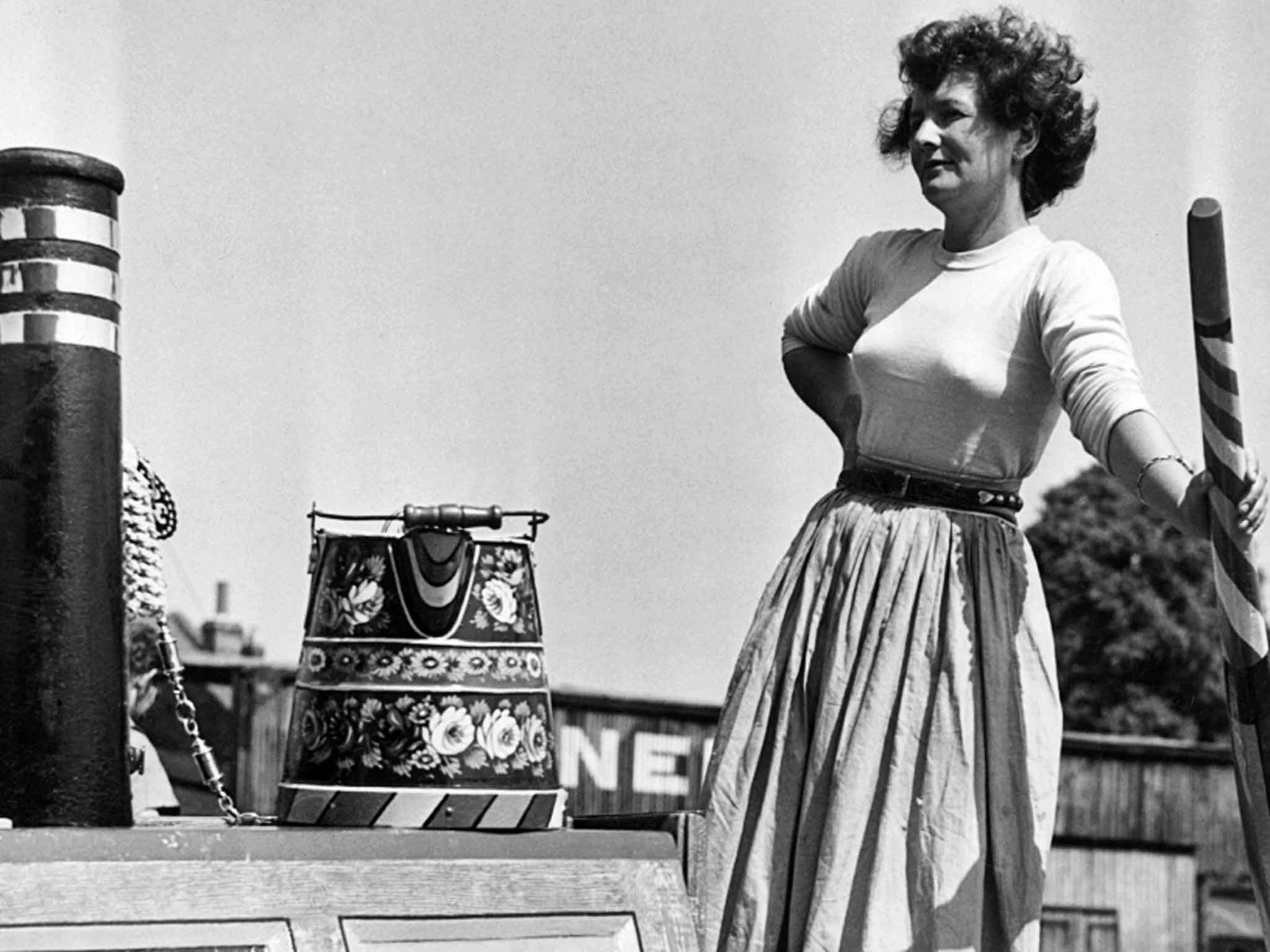 Rolt takes the tiller at the Market Harborough Festival and Rally of Boats in 1950