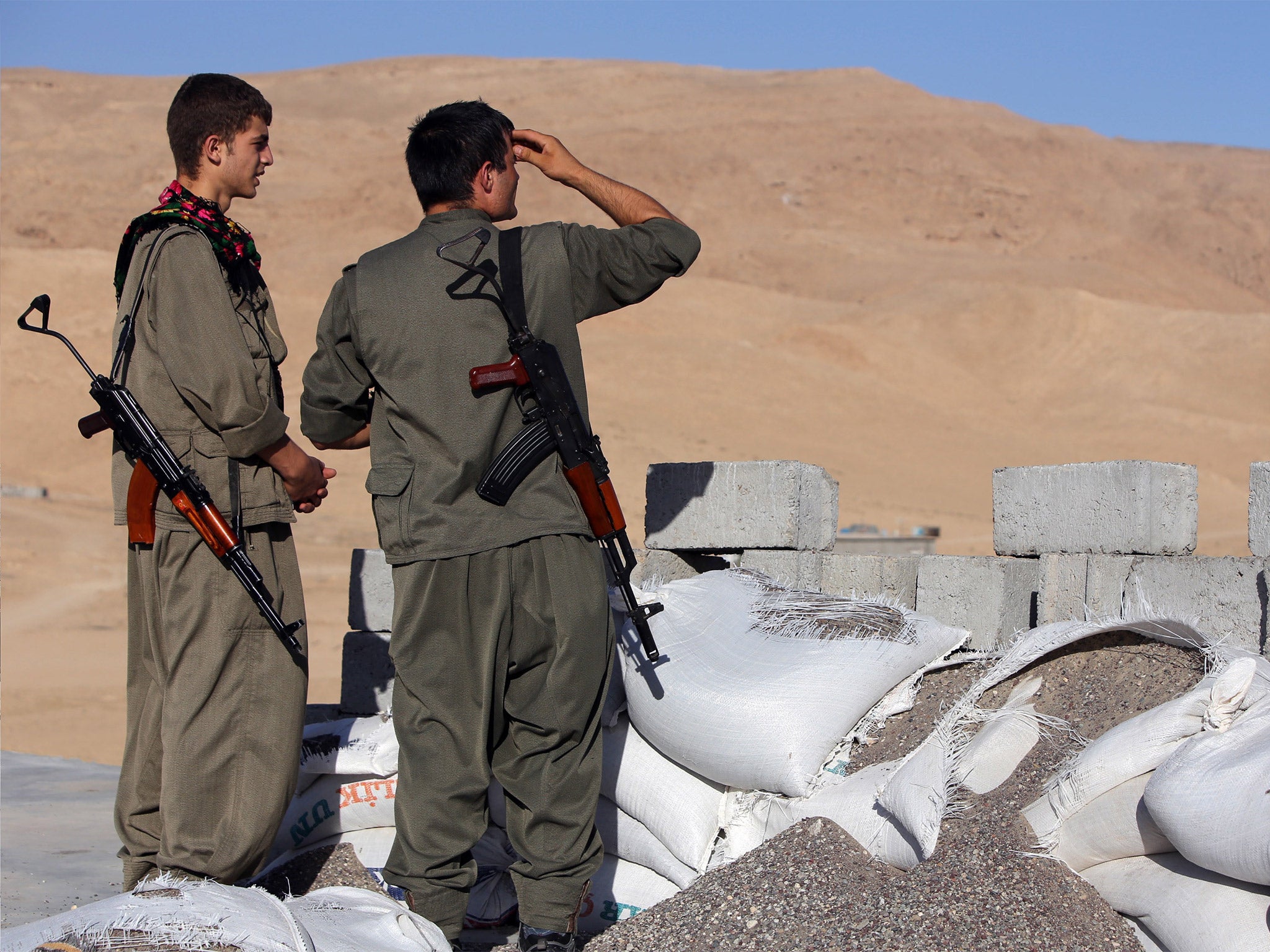 PKK fighters guard a post against Isis near Irbil, the capital of the autonomous Kurdish region in northern Iraq