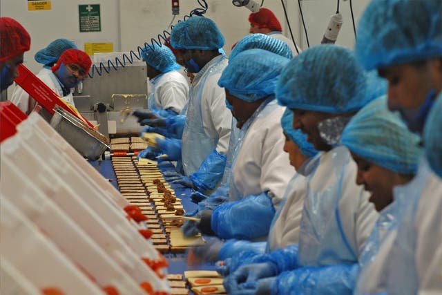 Workers on the sandwich production line at a Greencore factory