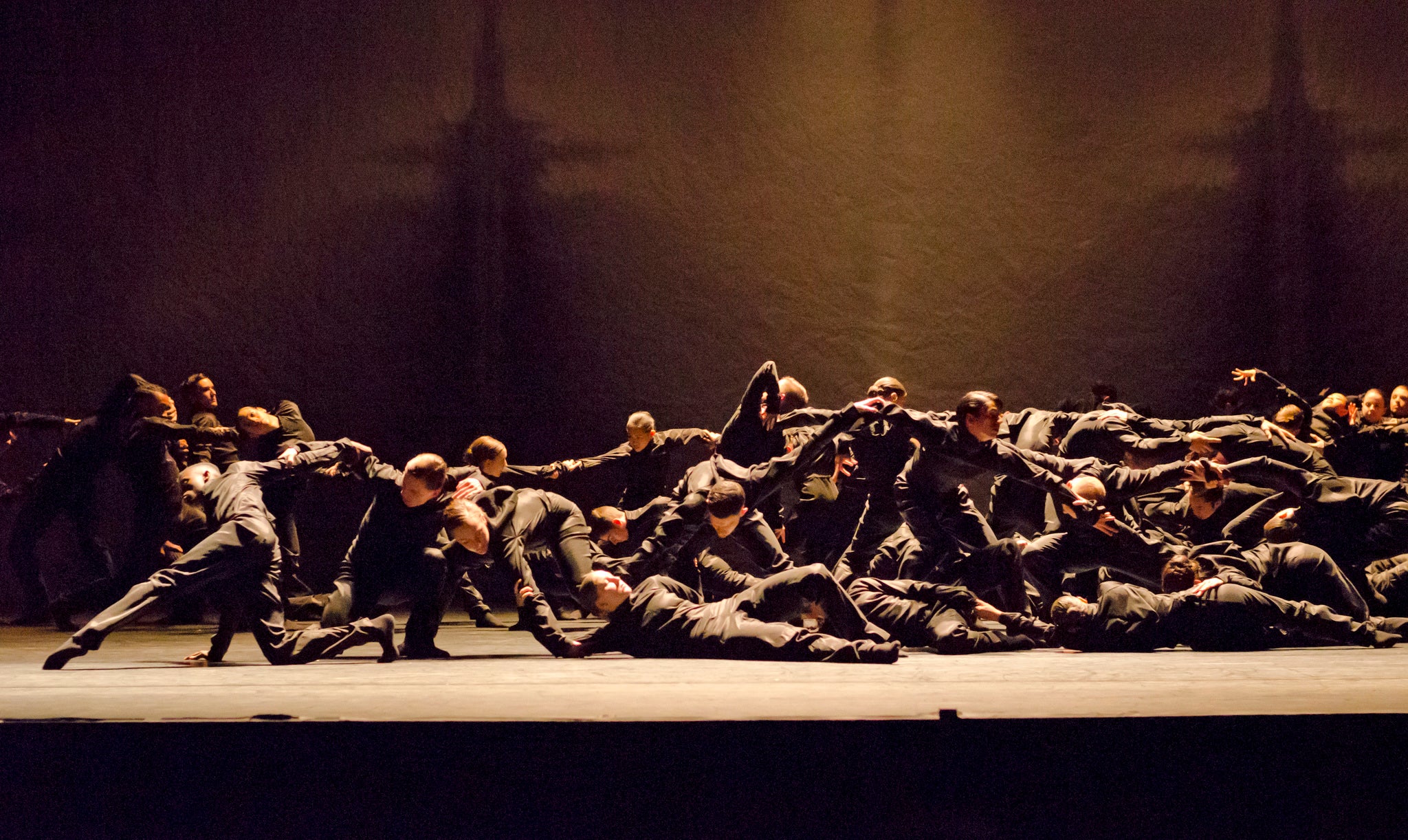 Polaris: 64 dancers flood and seethe over the stage, moving as a mass
