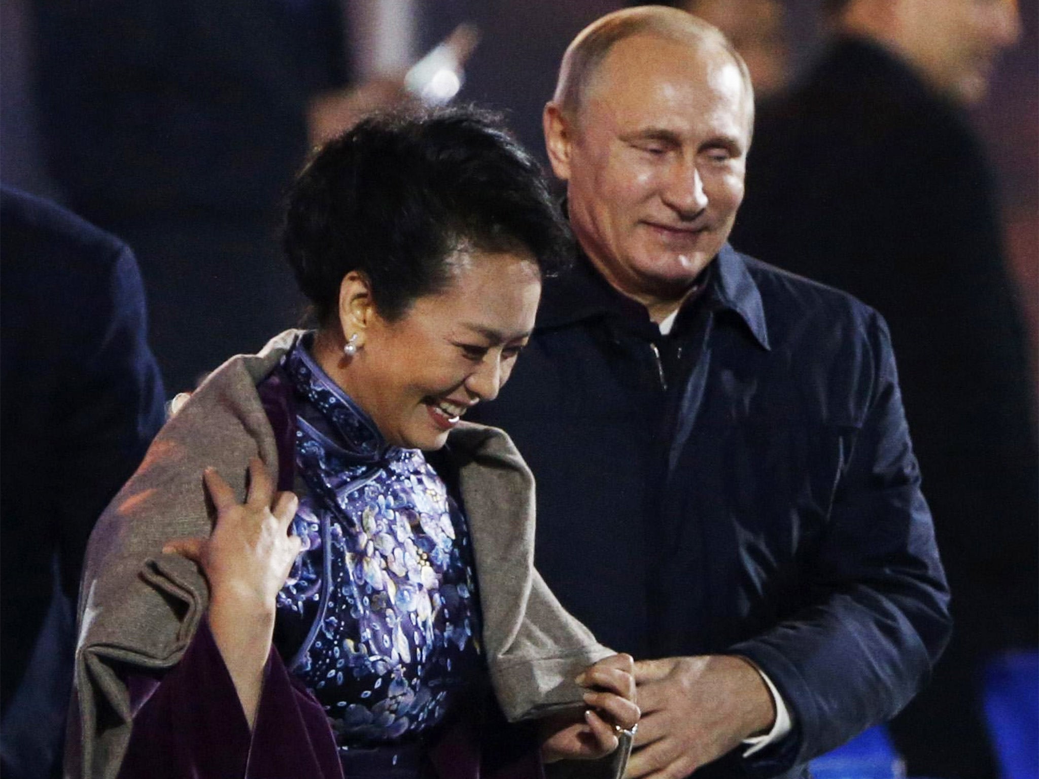Vladimir Putin got cosy with the Chinese First Lady, Peng Liyuan, while watching fireworks