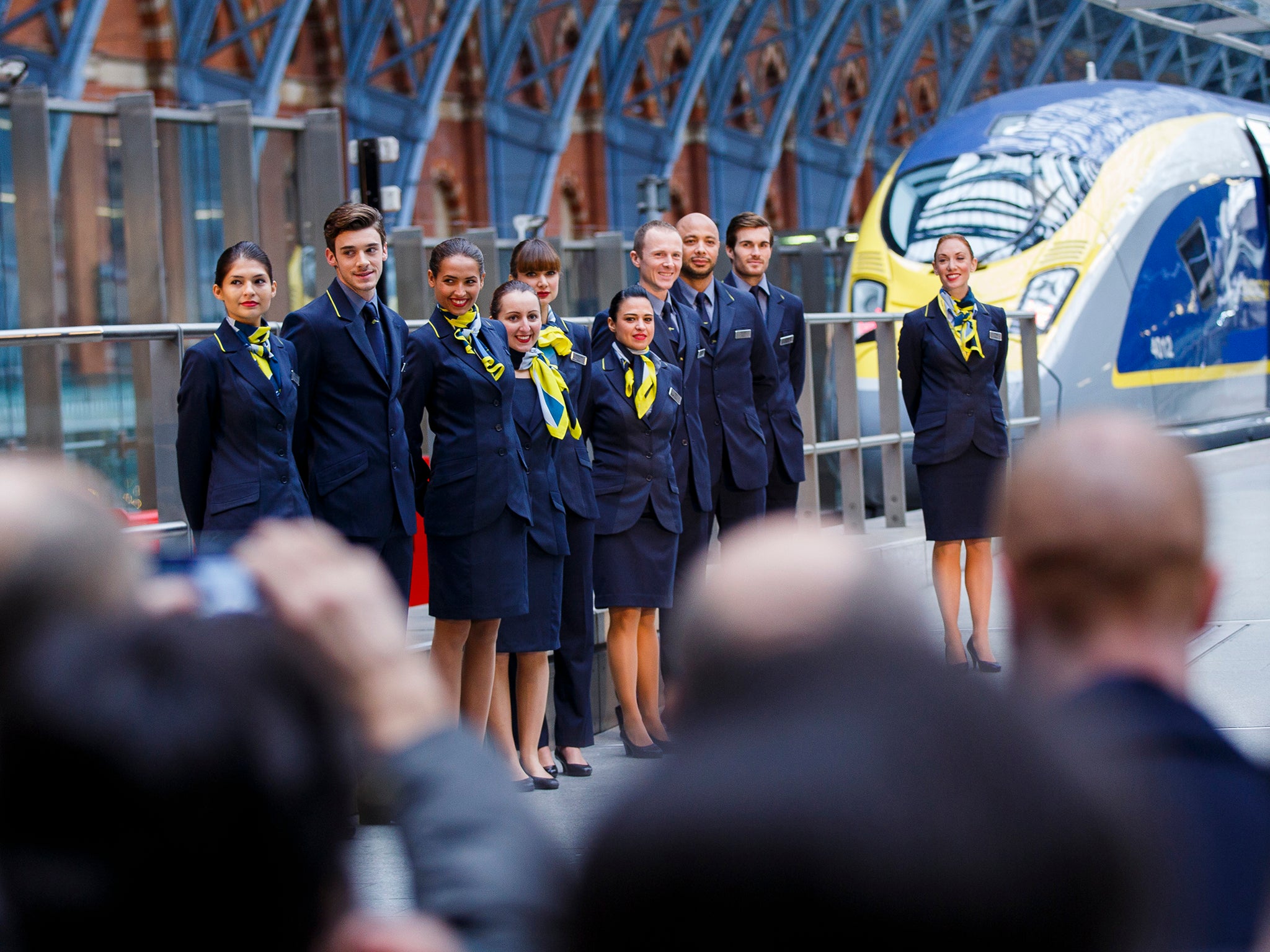 Members of Eurostar staff attend the unveiling Eurostar's brand new e320 fleet today complete with a live reveal of the train and special guests including Raymond Blanc and a catwalk show with 20 Eurostar staff at St Pancras Station on November 13, 2014 i