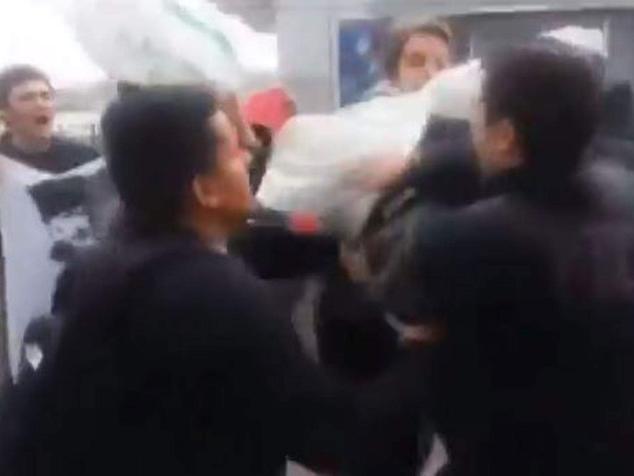 Footage has emerged of anti-American protesters in Turkey as they assaulted three US Navy soldiers, placing white sacks over their heads while chanting "Yankee, go home!"