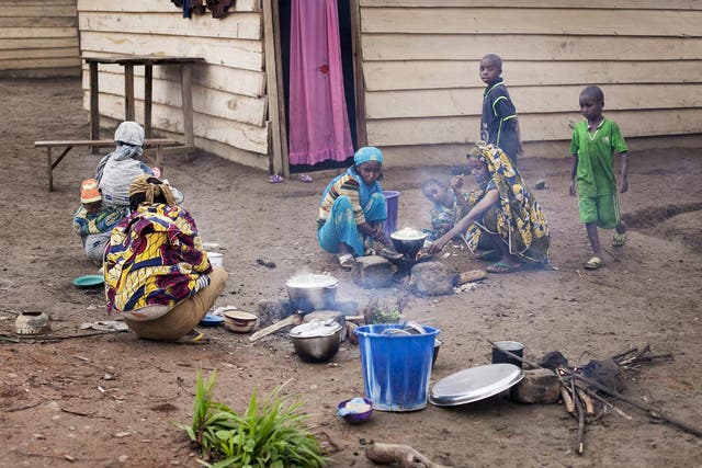 Women prepare a meal in a camp for refugees on the Cameroon-Central African Republic border