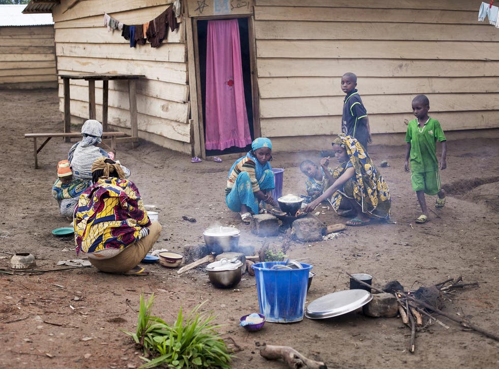 Women prepare a meal in a camp for refugees on the Cameroon-Central African Republic border