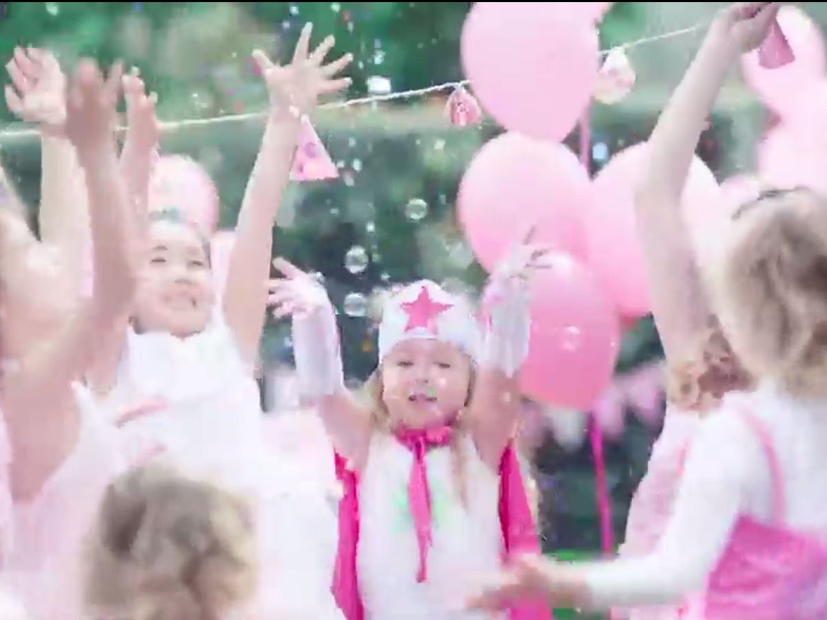 A little girl with autism joins in at a party, in a video raising awareness off the condition