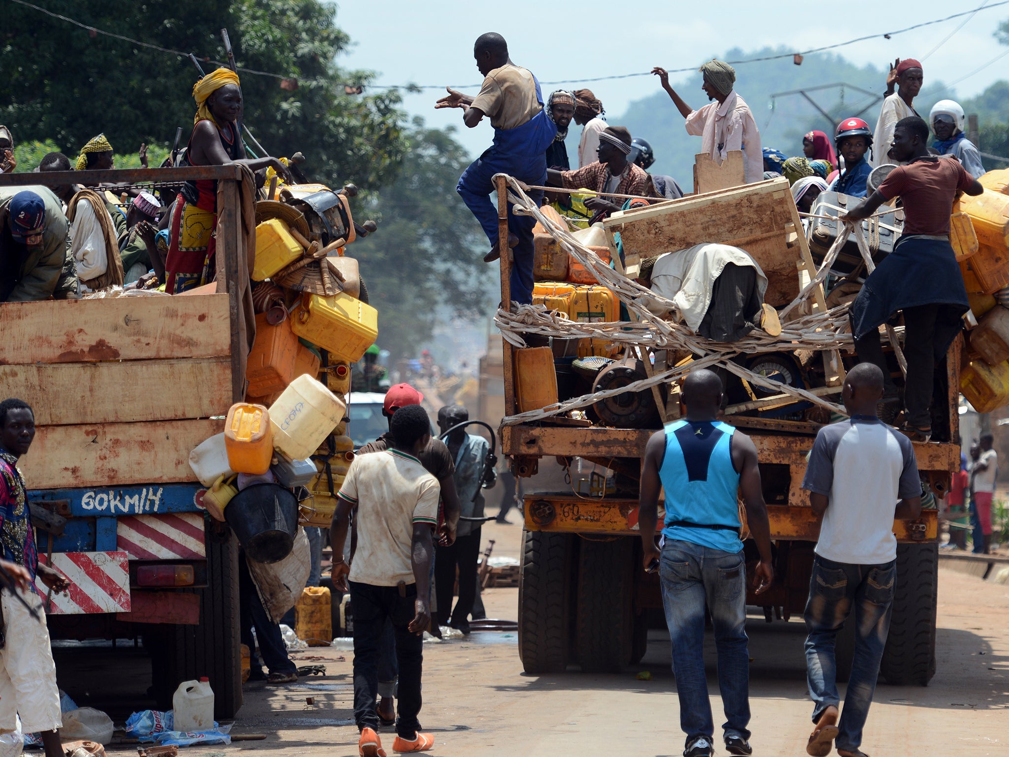 A convoy of vehicles carrying Muslims from the PK12 district, outside of Bangui, Central African Republic leaves the city in April