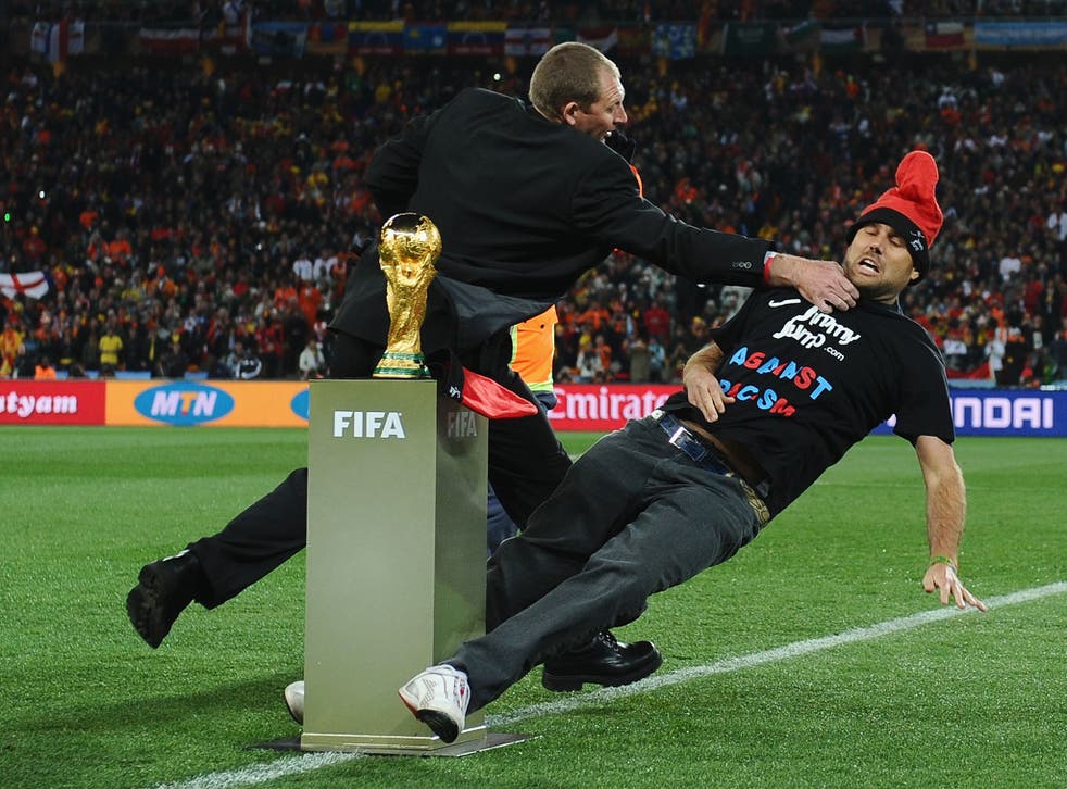 'Jimmy Jump' is wrestled to the ground by security ahead of the 2010 World Cup final in South Africa