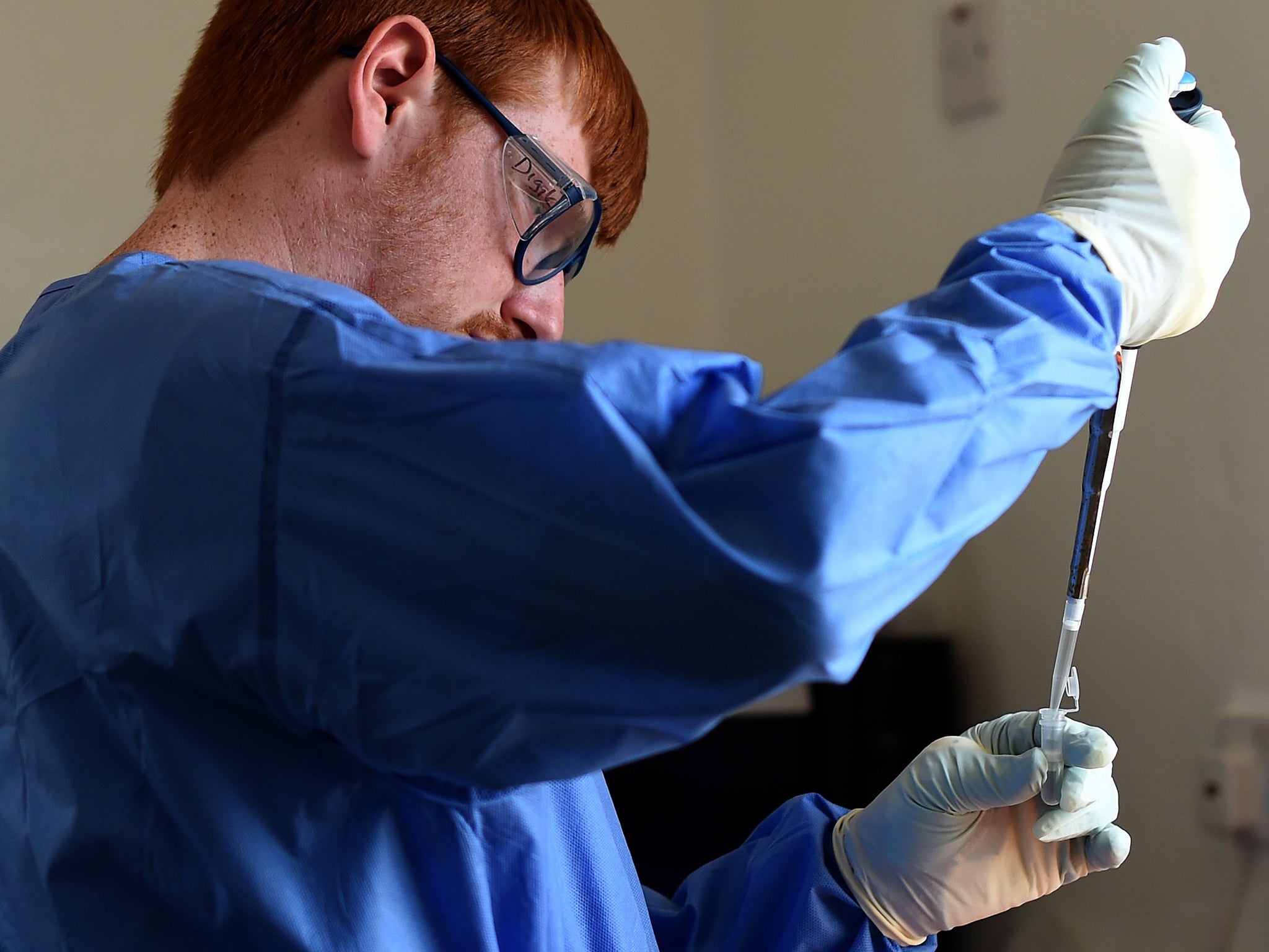 A virologist works in a testing lab in Kerry Town treatment centre (Getty Images)