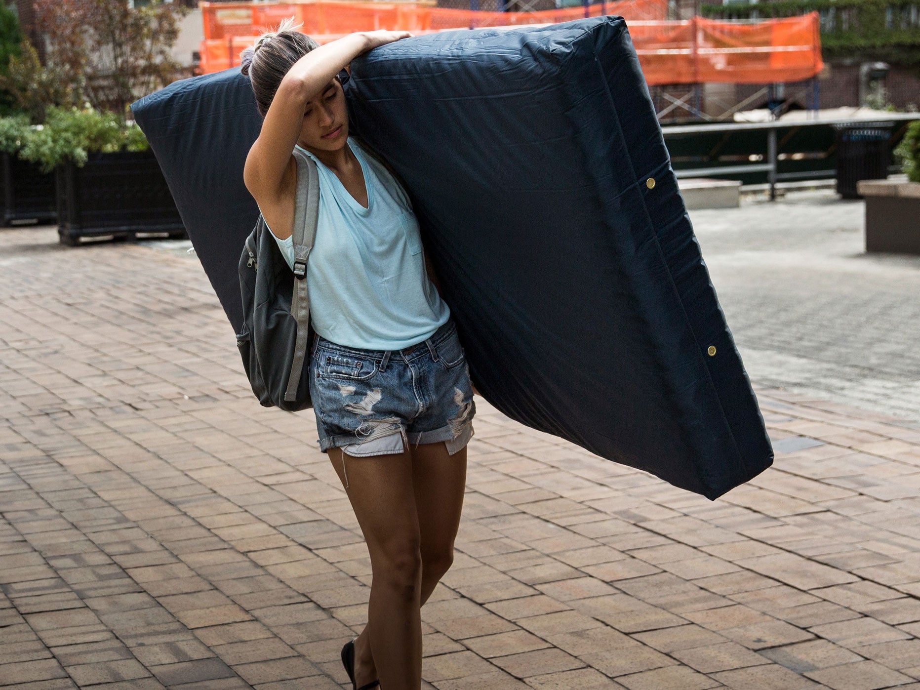 Emma Sulkowicz, carrying her mattress in protest of the university's lack of action after she reported being raped during her sophomore year