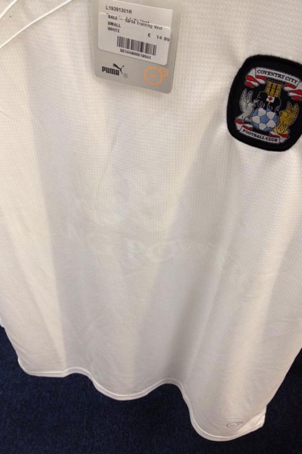 A Coventry City shirt with 'King Power' visible on the material