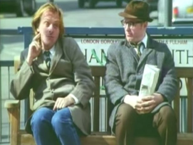Rik Mayall and Adrian Edmondson sitting on the Bottom bench