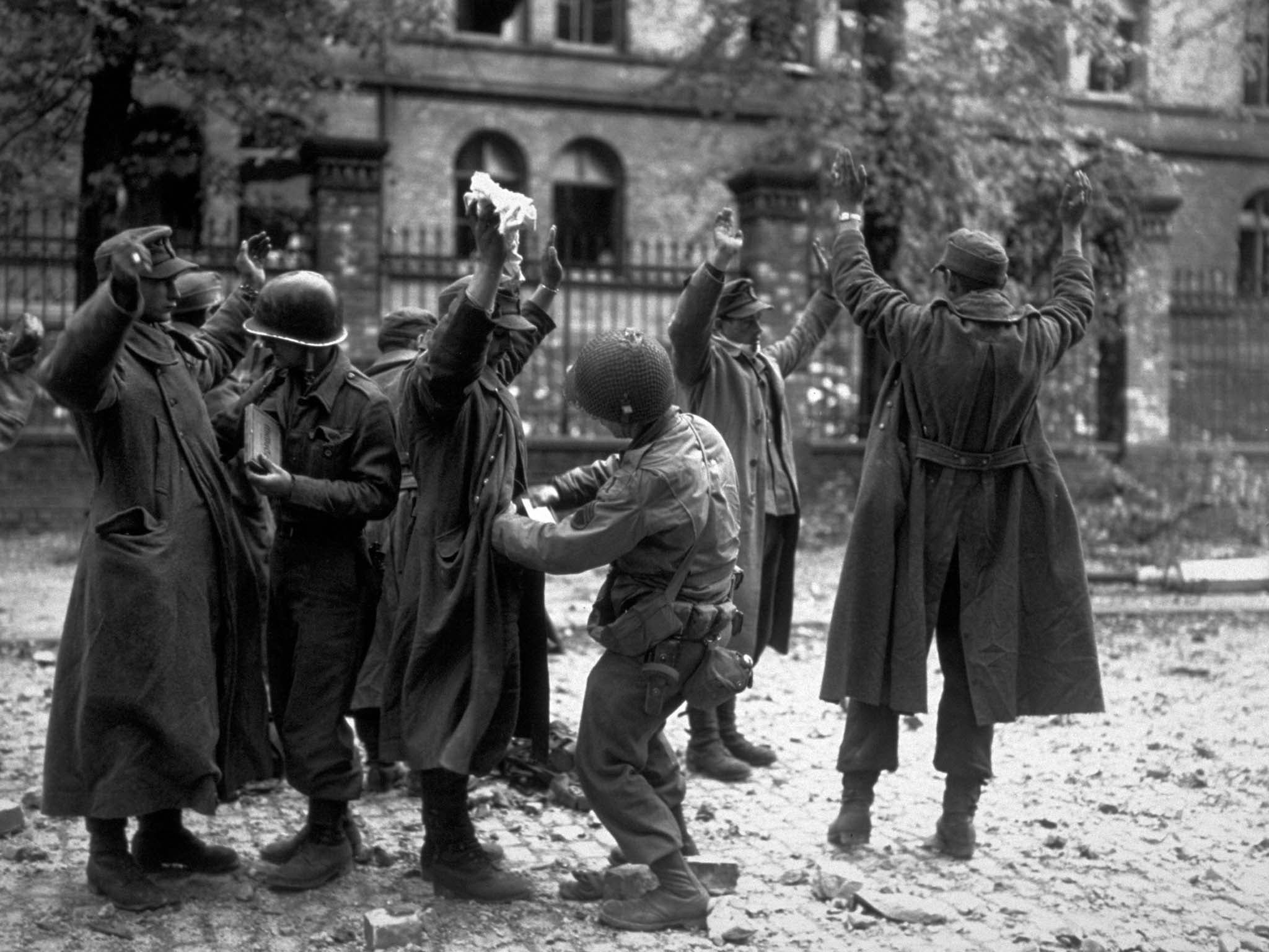 German prisoners captured in the streets of the German town of Aachen.