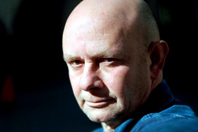 British writer Nick Hornby poses for photographers as he presents the Spanish edition of his book 'Juliet, Naked' 