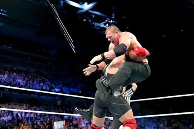 Ryback hits Kane with a spine-buster