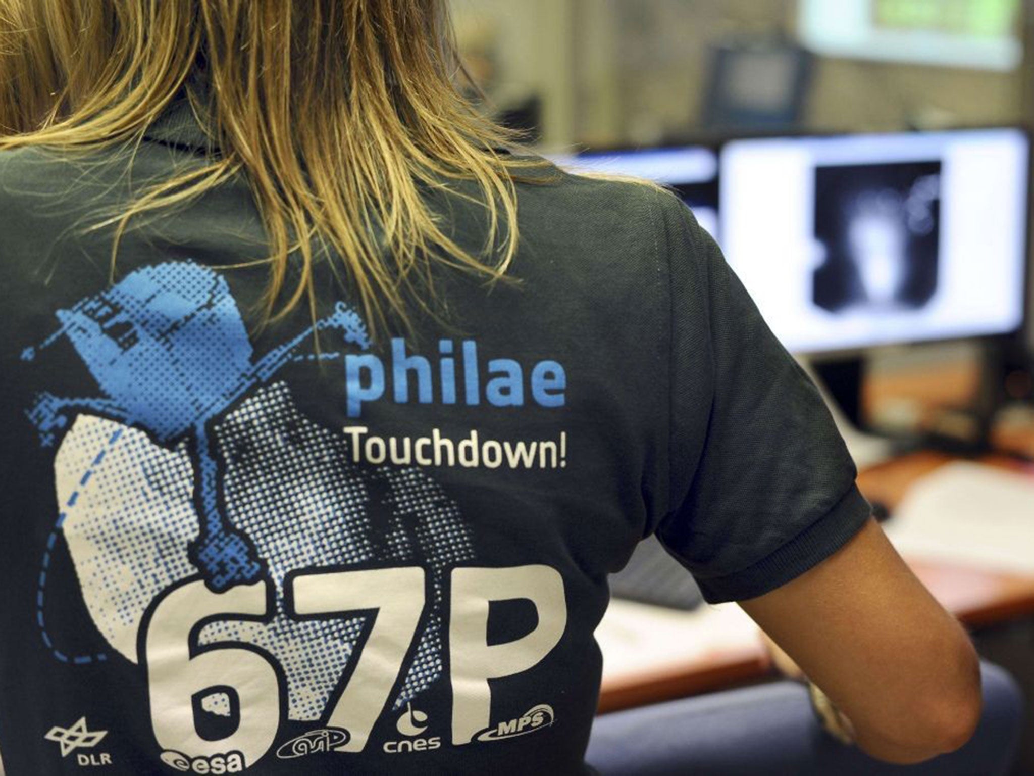 A scientist wears a t-shirt depicting the European Space Agency's (ESA) robot craft Philae