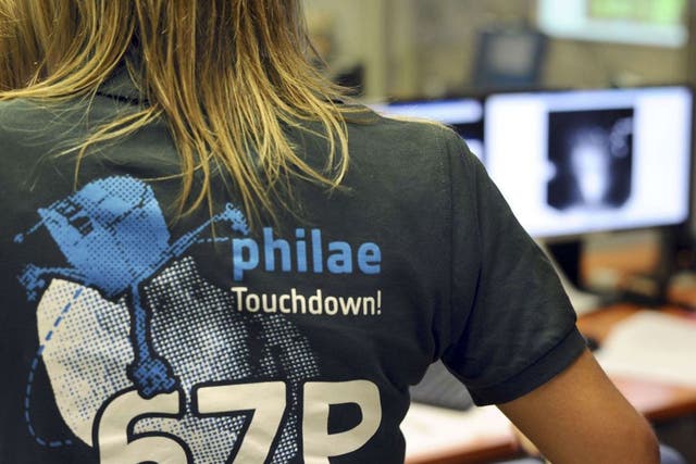 A scientist wears a t-shirt depicting the European Space Agency's (ESA) robot craft Philae 