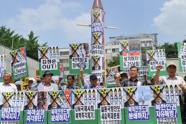 South Korean conservative activists demonstrate against North Korea's nuclear programs in Seoul in 2013.