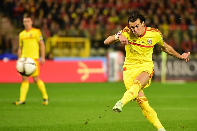 Gareth Bale strikes a free-kick during Wales goalless draw in Belgium
