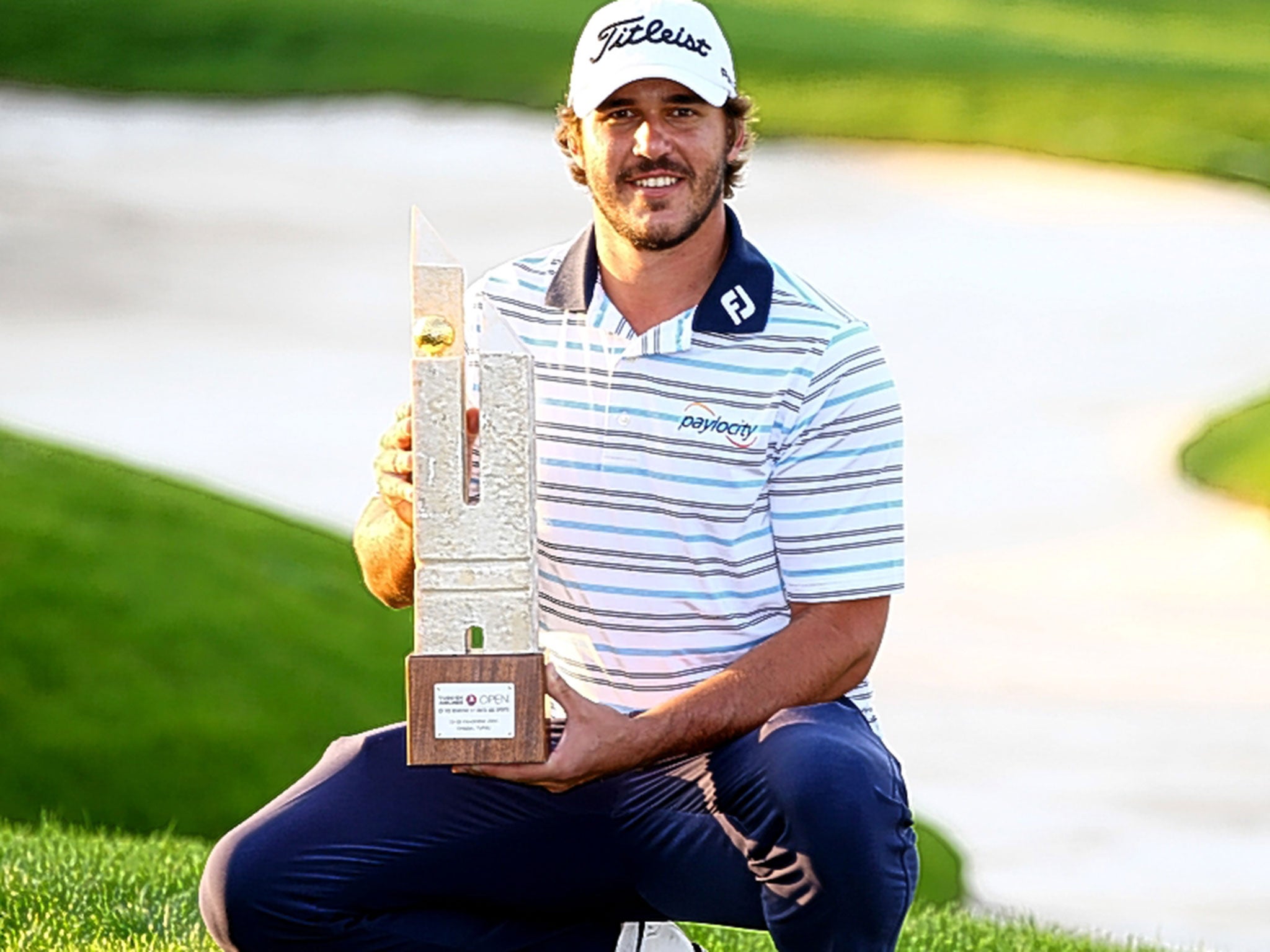 Brooks Koepka shows off his Turkish Airlines Open trophy